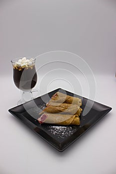 Cozy Dessert Scene with Crepes and Hot Chocolate