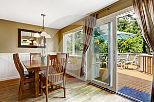 Cozy dining area and walkout deck photo