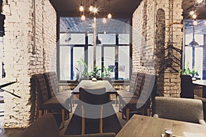 Cozy dining place at window, restaurant background