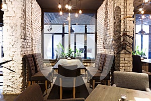 Cozy dining place at window, restaurant background