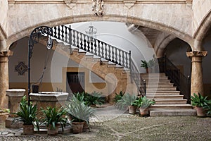 Cozy european patio with well and stairs