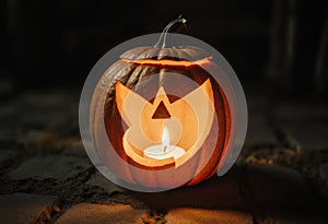 Detailed Close-Up of a Jack-o'-Lantern with a Burning Candle Inside, Casting a Warm Light and Emphasizing Texture