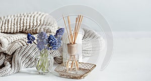 Cozy home composition with muscari flowers and aroma sticks