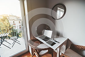 A cozy home desktop with a laptop