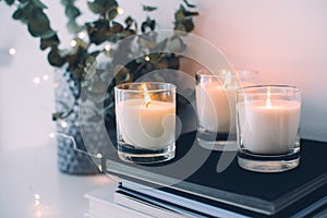 Cozy home interior decor, burning candles photo