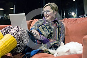 Cozy Home Interior and Woman using Computer along with Cat