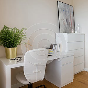 Cozy home office with white furniture
