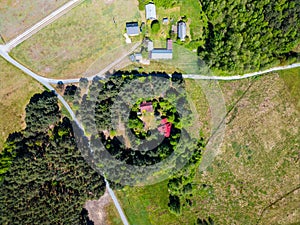 cozy house hidden in forest, shelter and hideaway summer home, aerial top view photo