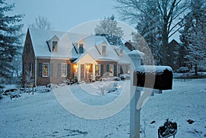 Cozy house in the snow on a winter evening in December