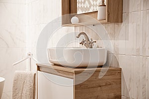 Cozy interior of the bathroom with a beautiful sink