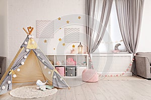 Cozy kids room interior with play tent