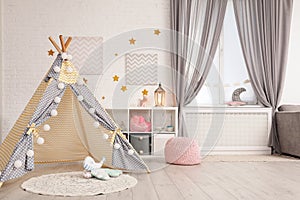 Cozy kids room interior with play tent