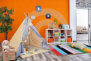 Cozy kids room interior with play tent