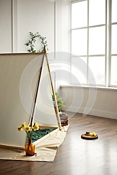 Cozy kids room interior with play tent and toys.