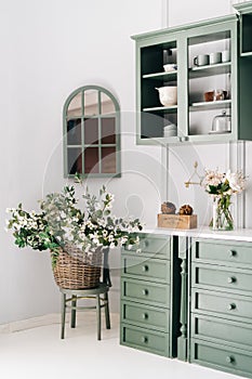 Cozy kitchen corner with green vintage furniture