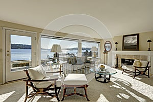 Cozy light filled family room with a wall of windows