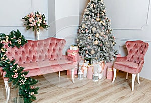 Cozy living room with Christmas tree. Interior in a photo studio