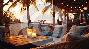 cozy Luxury resort, evening beach, candles blurred light on table ,sofa, hammock on front sunset sea