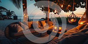 cozy Luxury resort, evening beach, candles blurred light on table ,sofa, hammock on front sunset sea