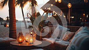 cozy Luxury resort, evening beach, candles blurred light on table ,sofa, hammock on front sunset sea