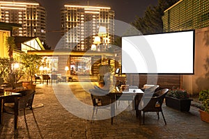 Cozy modern interior of restaurant, teahouse with white projector screen