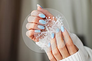 Cozy nails with winter manicure with snowflakes