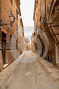 Cozy narrow street in Ferrara, Emilia-Romagna, Italy.