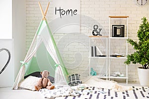 Cozy play tent for kids in interior of room