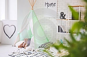 Cozy play tent for kids in interior of room