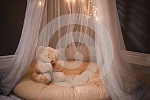 Cozy play tent with teddy bear indoors