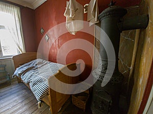 Cozy Retreat: A Vintage Copenhagen Bedroom with a Wood Stove