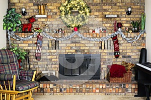 Cozy room with brick fireplace decorated for Christmas, rocking