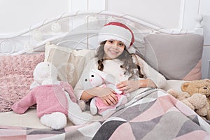 Cozy room. Child waiting christmas in bedroom. Kid lay in bed relaxing. Home is best place in world. Girl little kid