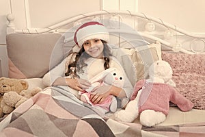 Cozy room. Child waiting christmas in bedroom. Kid lay in bed relaxing. Home is best place in world. Girl little kid