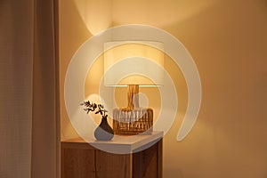 Cozy scene with a warm light lamp in a corner