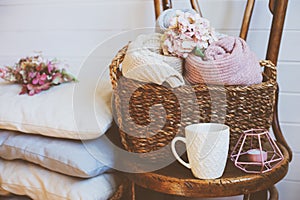 cozy still life interior details. Organizing clothes in wicker baskets