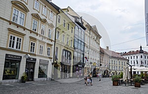 Cozy street with colorful buildings in the old town historic center of Ljubljana, capital of Slovenia