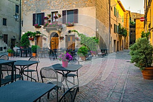 Cozy street cafe at early morning in Tuscany, Pienza, Italy