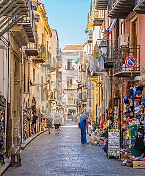 A cozy street in CefalÃÂ¹, rich with details and colors. Sicily, southern Italy.