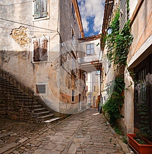 Cozy street in Groznjan town, Croatia. Old architecture of Groznjan, Croatia