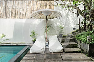 Cozy sunbed side swimming pool