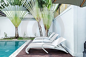 Cozy sunbed side swimming pool