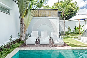 Cozy sunbed side swimming pool