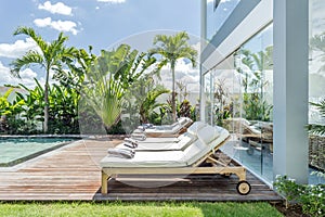 Cozy sunbed side swimming pool