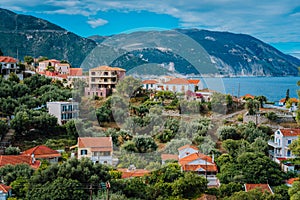 Cozy town, relaxing, summer feeling. Red roofs of Assos village at the lush green Mediterranean place of Kefalonia