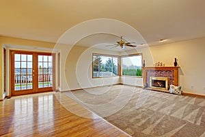 Cozy unfurnished living room with carpet.