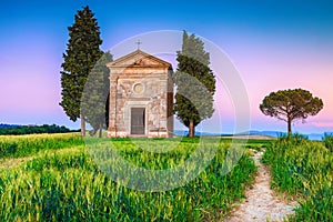 Cozy Vitaleta chapel and grain field at sunset, Tuscany, Italy