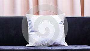 A cozy white pillow on a clean soft background perfect for adding comfort to any bedroom