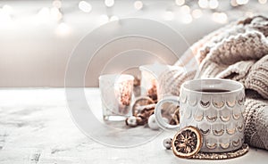 Cozy winter composition with a cup and sweater
