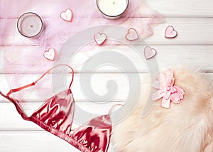 Cozy Winter Flatlay with Heart Candles, Gifts and Warm Knitted Plaid. Pink Still life for St. Valentines Day, Womans Day